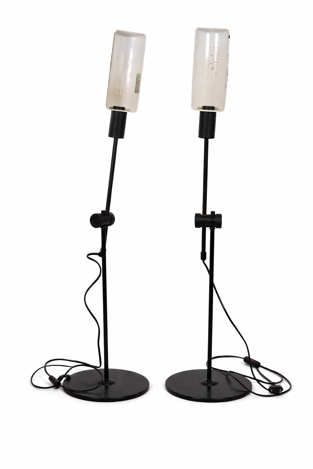 Two black floor lamps with clear lampshades on a white background