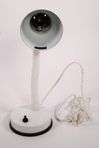 Vintage desk lamp with flexible neck on a white background