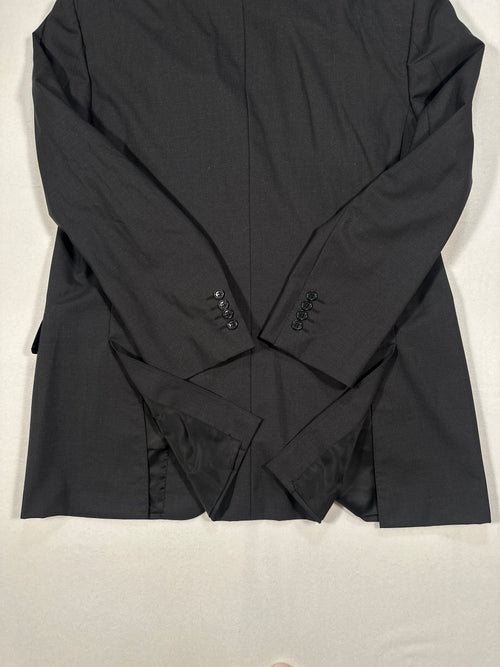 Black shirt with brand logo on a light gray background